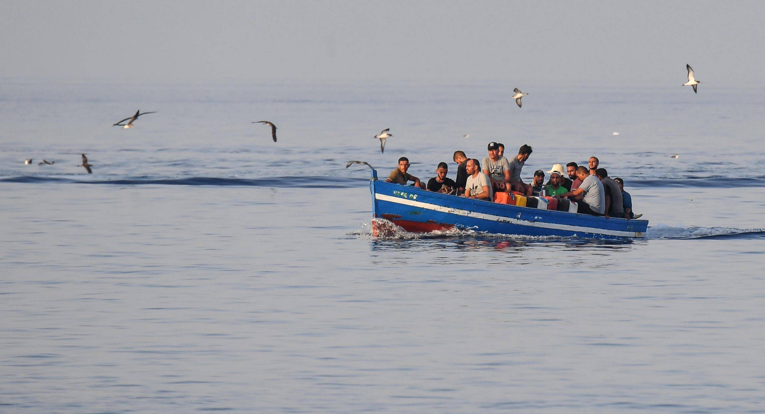 migranti-scaled.jpeg